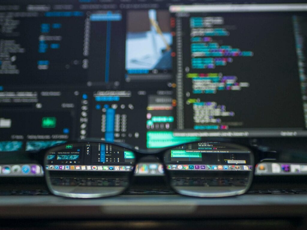 Data visualisation and code seen through glasses – symbolising clarity in digital marketing insights