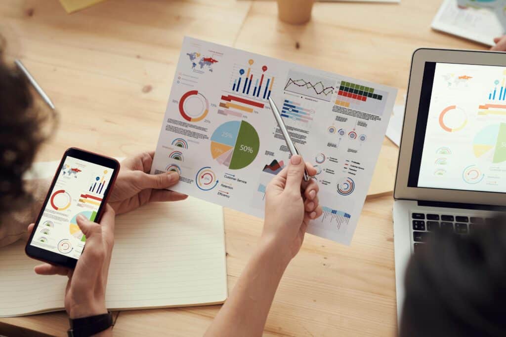 Team reviewing digital marketing analytics and performance charts for data-driven strategy