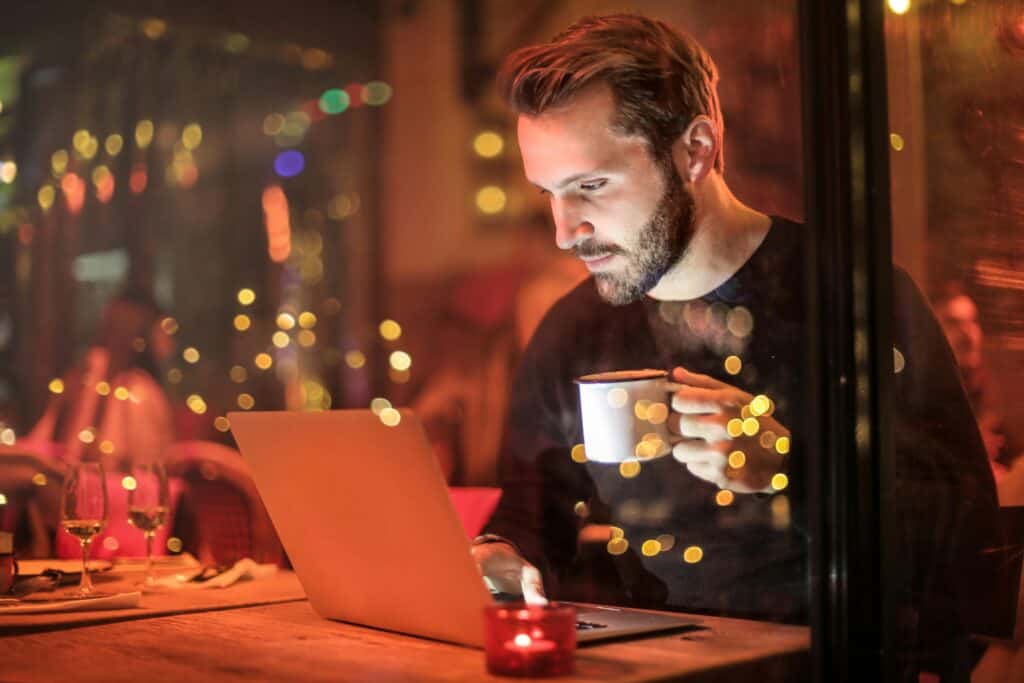 web designer working on laptop, implementing content-first design